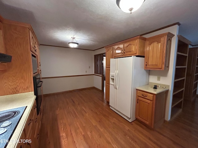 kitchen featuring a textured ceiling, black appliances, wood-type flooring, and range hood