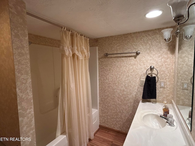 bathroom featuring vanity, shower / tub combo with curtain, and hardwood / wood-style flooring