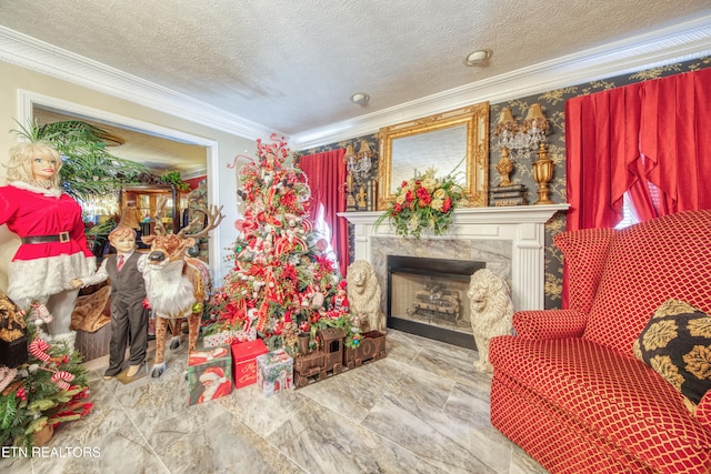 living area with crown molding, a textured ceiling, and a fireplace