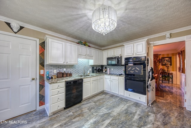 kitchen with ornamental molding, sink, black appliances, an inviting chandelier, and white cabinets