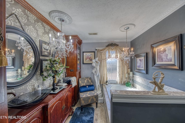 bathroom featuring vanity, a notable chandelier, ornamental molding, and a wealth of natural light