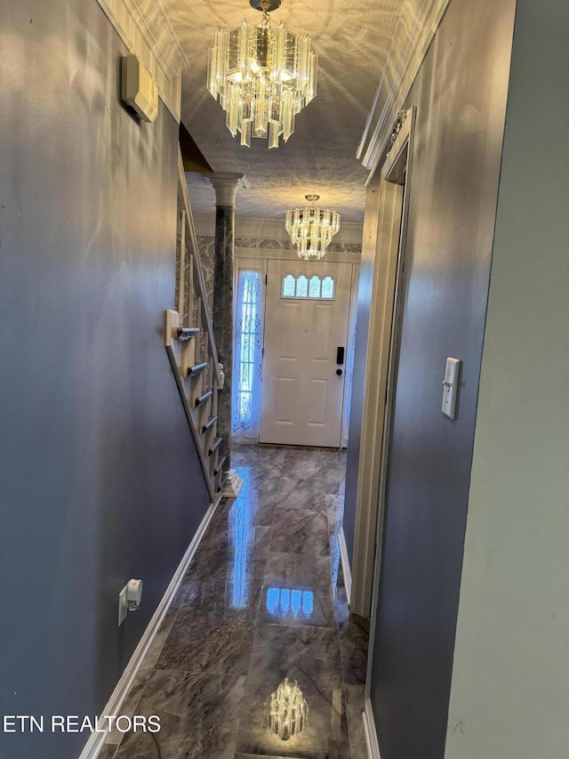 doorway featuring marble finish floor, stairway, baseboards, and an inviting chandelier