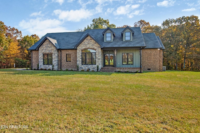 view of front of home with central AC and a front lawn