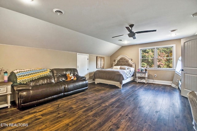 bedroom with lofted ceiling, dark hardwood / wood-style floors, and ceiling fan