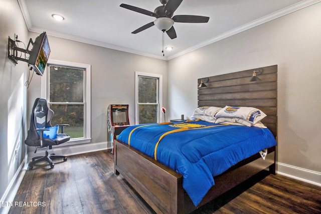 bedroom with dark hardwood / wood-style flooring, crown molding, and ceiling fan