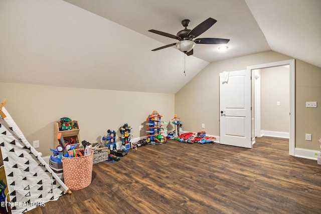 game room with vaulted ceiling, dark hardwood / wood-style floors, and ceiling fan