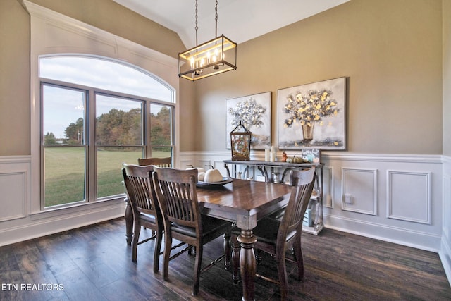 dining room with a chandelier and dark hardwood / wood-style floors