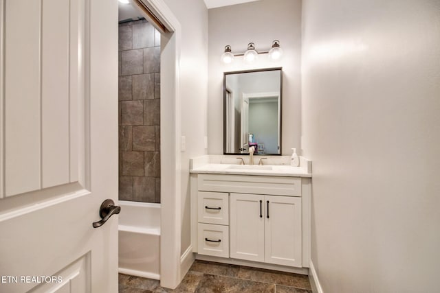 bathroom with vanity and tiled shower / bath combo