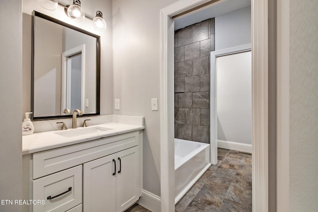 bathroom featuring vanity and a bathtub