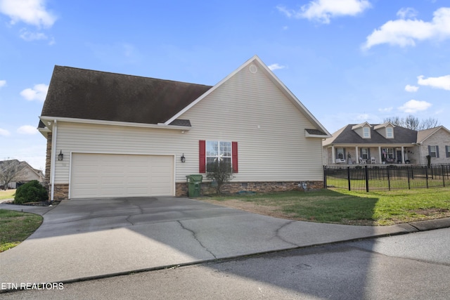 view of front facade featuring a front yard and a garage