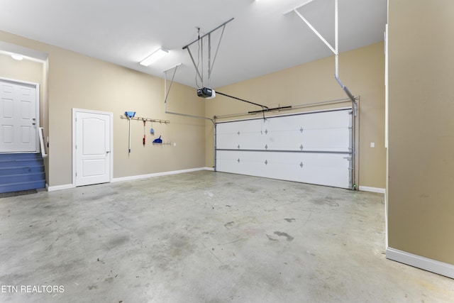 garage featuring a garage door opener