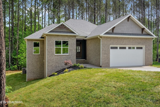 214 Cheeyo Trce, Loudon, TN 37774 - view of front of house with a garage, a front yard, brick siding, and a shingled roof