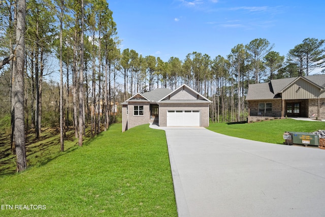 214 Cheeyo Trce, Loudon, TN 37774 - view of front of home featuring a garage, concrete driveway, and a front lawn