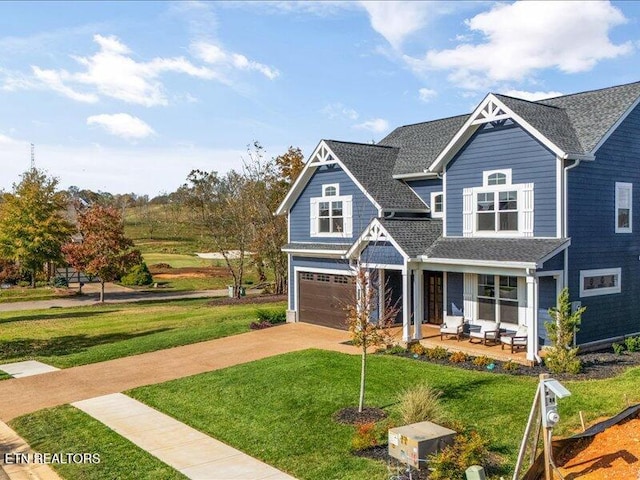 318 Buckhorn Way, Loudon, TN 37774 - view of front of home featuring a garage, a front lawn, concrete driveway, and a porch
