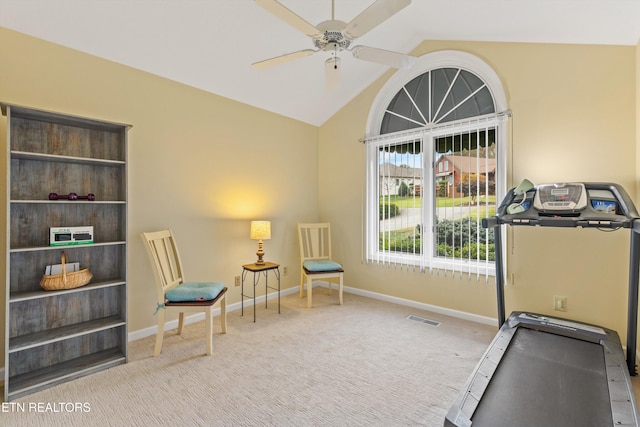 interior space featuring light carpet, lofted ceiling, and ceiling fan