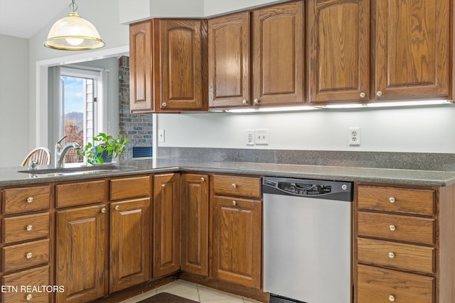 kitchen with pendant lighting, light tile patterned flooring, stainless steel dishwasher, and sink