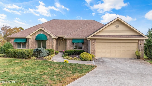 single story home with a garage and a front yard