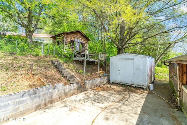 view of patio / terrace with a storage unit