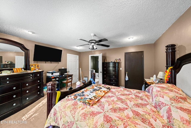 bedroom with ceiling fan and a textured ceiling