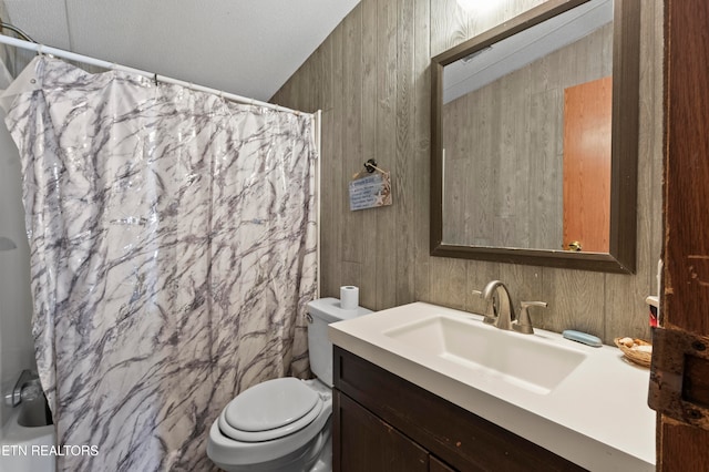 bathroom with a shower with shower curtain, vanity, toilet, and tile walls