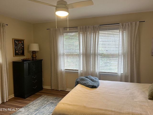 bedroom featuring dark wood-type flooring and ceiling fan