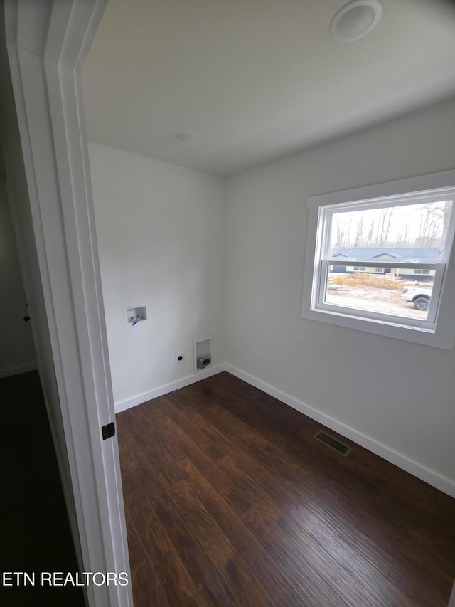 laundry area with dark hardwood / wood-style flooring, hookup for a washing machine, and electric dryer hookup