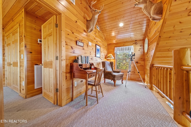 interior space featuring light carpet, wood ceiling, wood walls, and vaulted ceiling