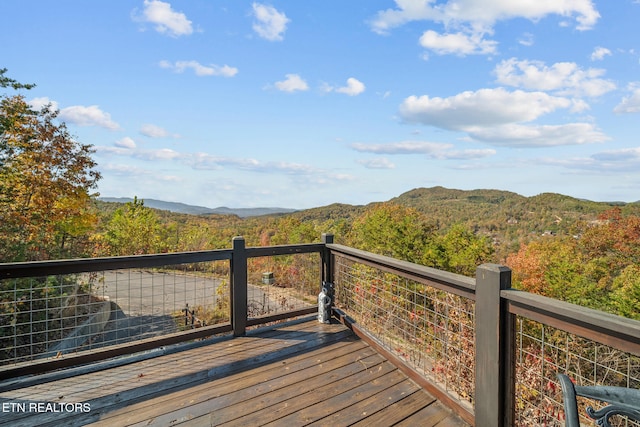 wooden deck with a mountain view