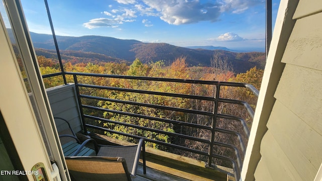 balcony featuring a mountain view