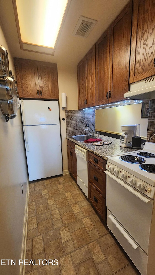 kitchen with range hood, sink, decorative backsplash, and white appliances