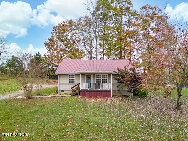 view of front of property with covered porch and a front yard