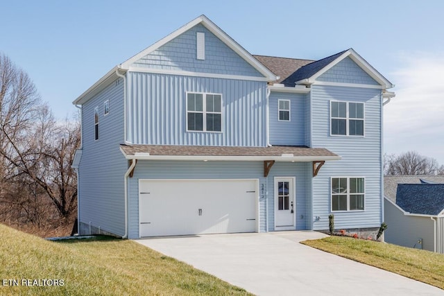 view of front facade featuring a garage and a front lawn