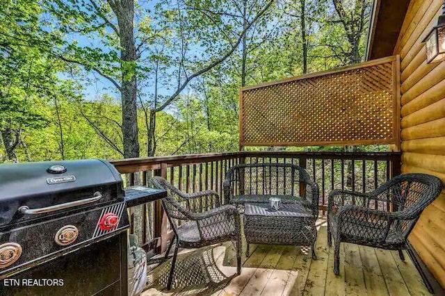 wooden terrace featuring grilling area