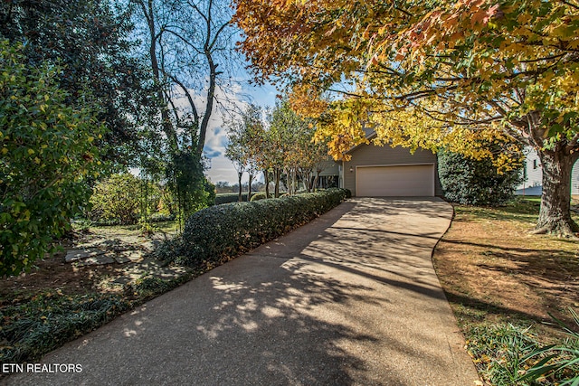 view of front of home with driveway and an attached garage