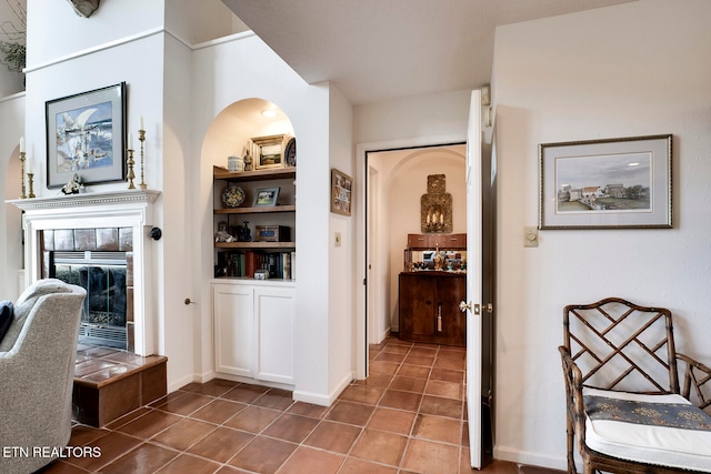 corridor with dark tile patterned flooring