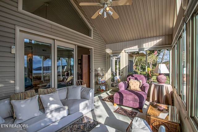 sunroom featuring a wealth of natural light, lofted ceiling, and ceiling fan