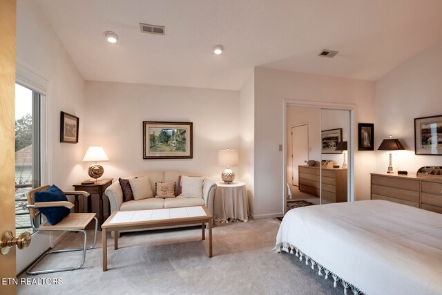 carpeted bedroom featuring baseboards, visible vents, and recessed lighting