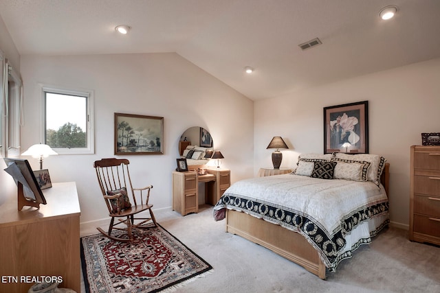 bedroom featuring lofted ceiling, visible vents, light carpet, and baseboards