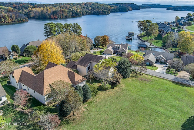 aerial view with a residential view, a water view, and a forest view