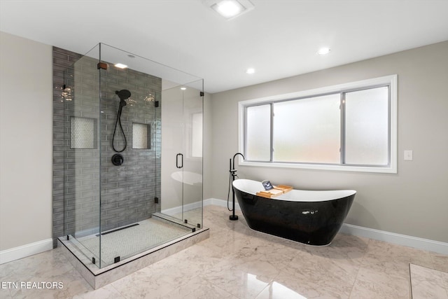 bathroom with shower with separate bathtub