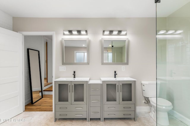 bathroom featuring vanity, toilet, and hardwood / wood-style flooring