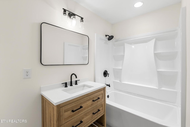 bathroom with vanity and bathing tub / shower combination