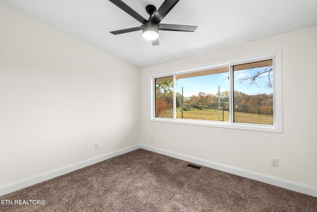 empty room with carpet and ceiling fan