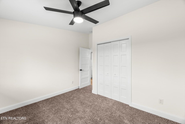 unfurnished bedroom with a closet, carpet floors, and ceiling fan