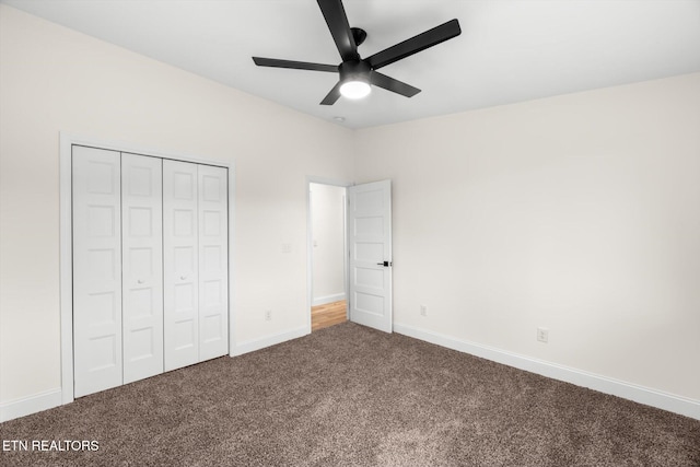 unfurnished bedroom with a closet, carpet floors, and ceiling fan