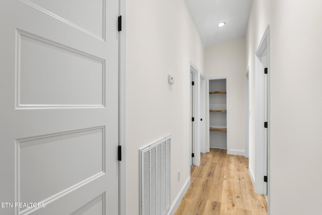 corridor with light wood-type flooring