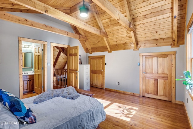 bedroom with ensuite bath, vaulted ceiling with beams, wooden ceiling, and light hardwood / wood-style flooring