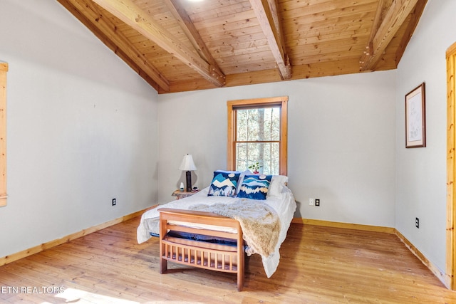 bedroom featuring hardwood / wood-style floors, lofted ceiling with beams, and wooden ceiling