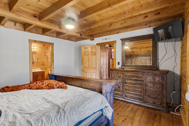 bedroom with dark wood-type flooring, ensuite bathroom, beam ceiling, and wooden ceiling