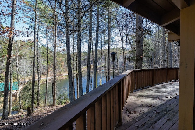 wooden terrace with a water view